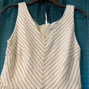 Wide legged pant suit with pockets.